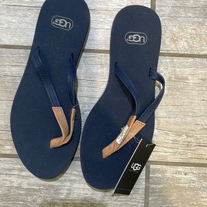 Ugg NWT navy blue flip flops with tan accents
